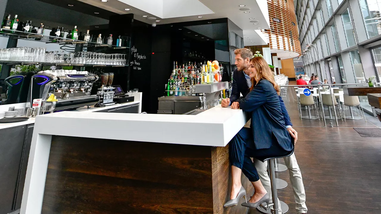 Two people sitting at the bar