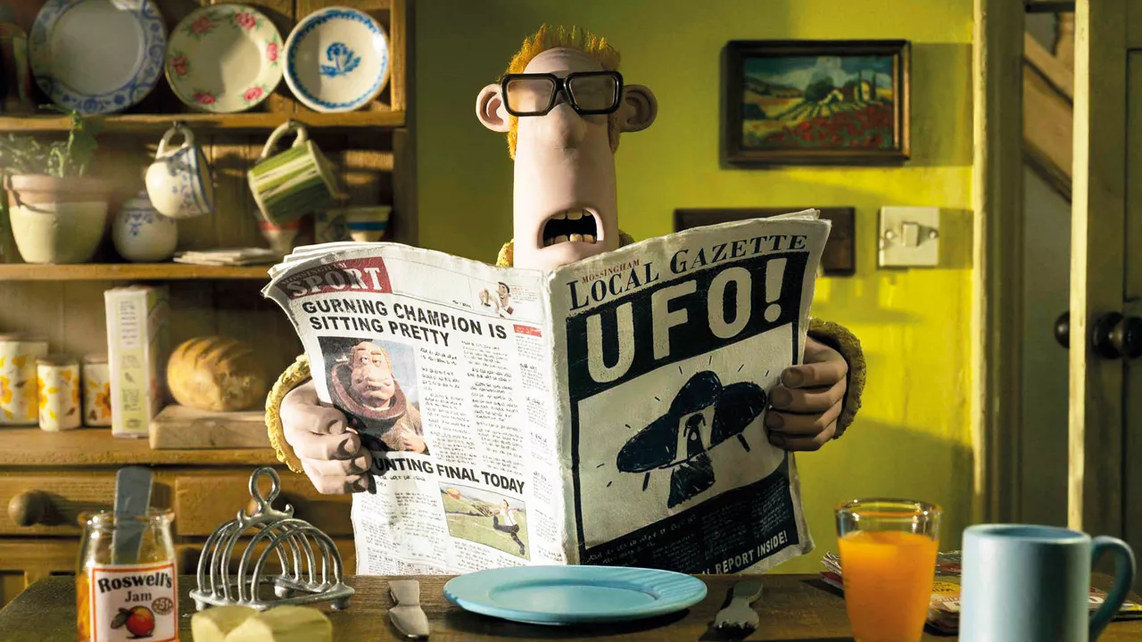 Der Bauer liest am Frühstückstisch die Schlagzeilen in seiner Zeitung.