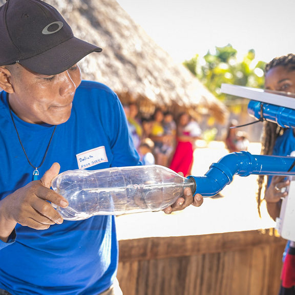 A volunteer works on a construct
