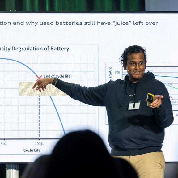 Speaker in front of a chart