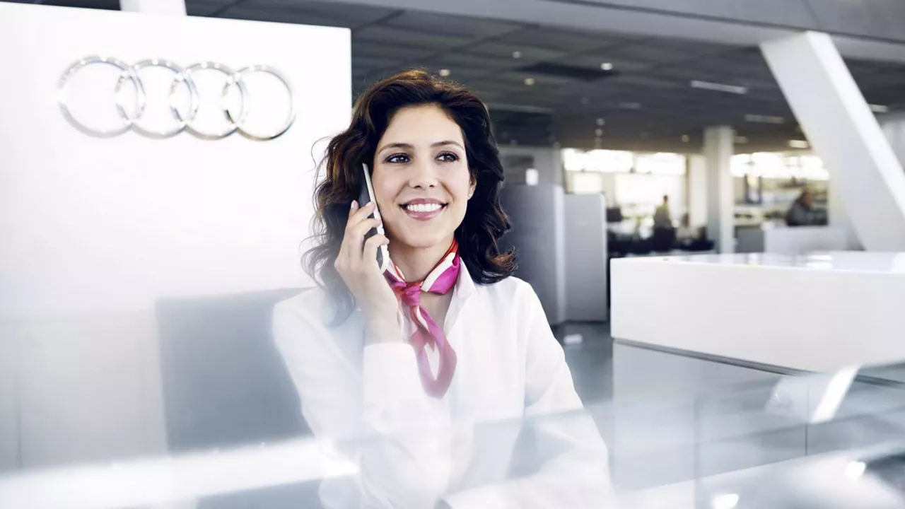 Audi staff member taking a call about Fleet solutions