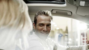 Gentleman looking at his partner sitting in his Audi - Chattel Mortgage