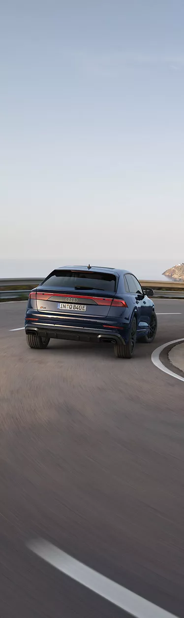 Audi Q8 SUV TFSI e rear view at the charging station