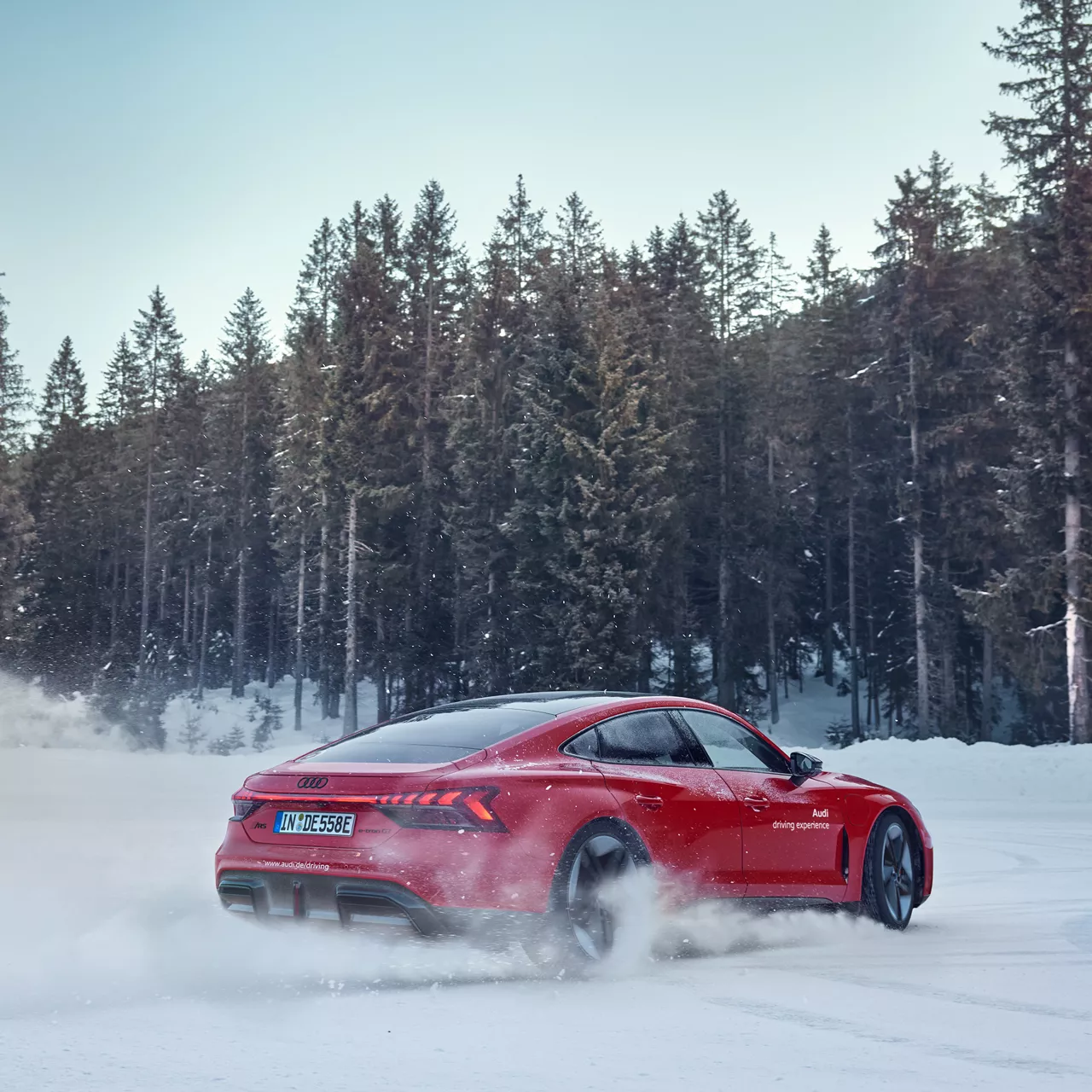 Red Audi RS e-tron GT performance drifts in the snow