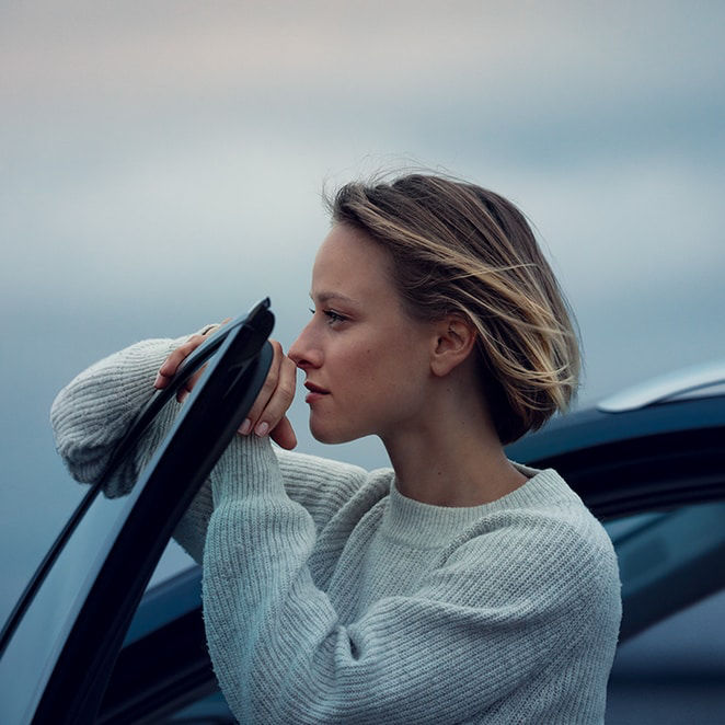 Woman leaning on the door 