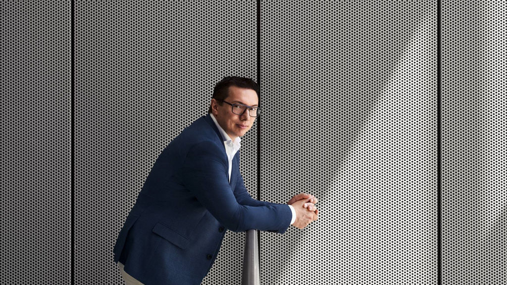 Giorgio Delucchi leaning against a handrail.