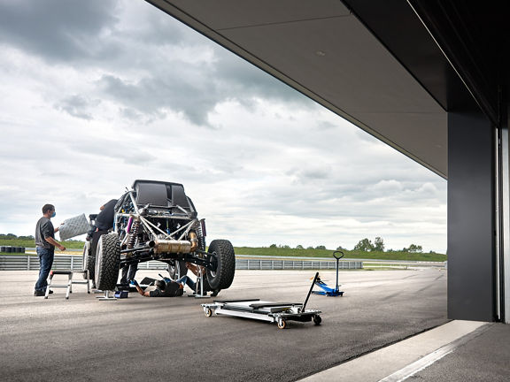 The vehicle is assembled in the open air.