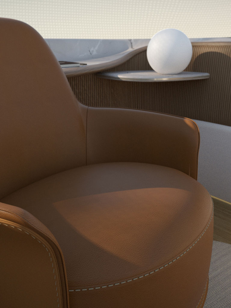 Le design intérieur conçu par Poliform propose un fauteuil marron.