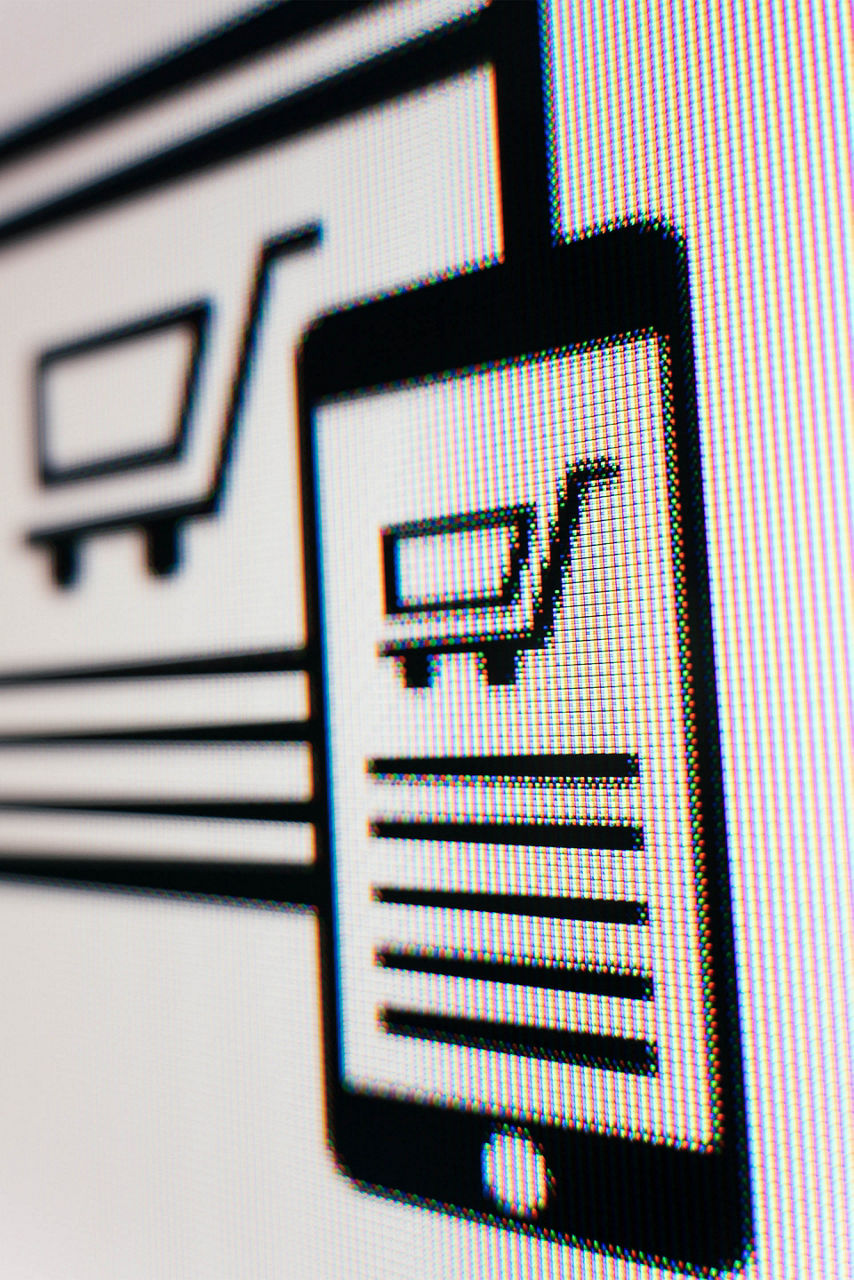 Close-up of a screen shows the illustration of a smartphone displaying a shopping cart with five lines.