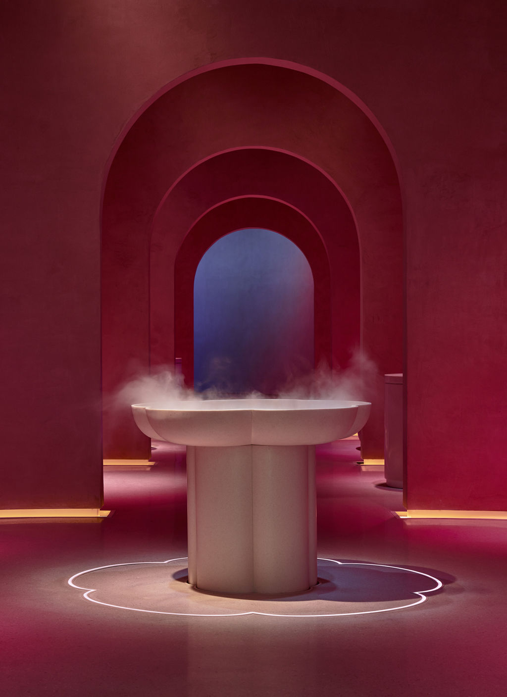 A view inside the spa with vapour pouring from a fountain.