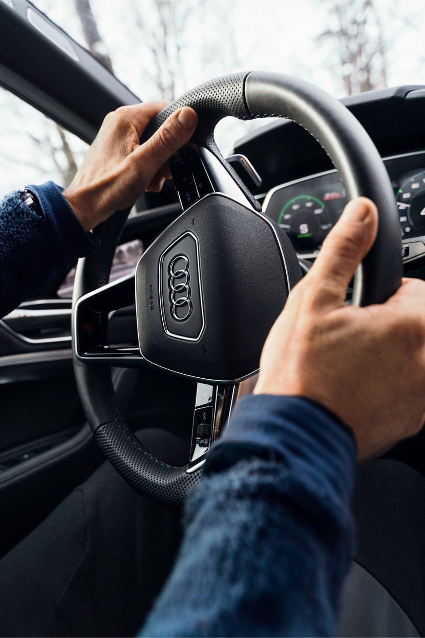 Close-up of Copeland’s hands while driving his car.