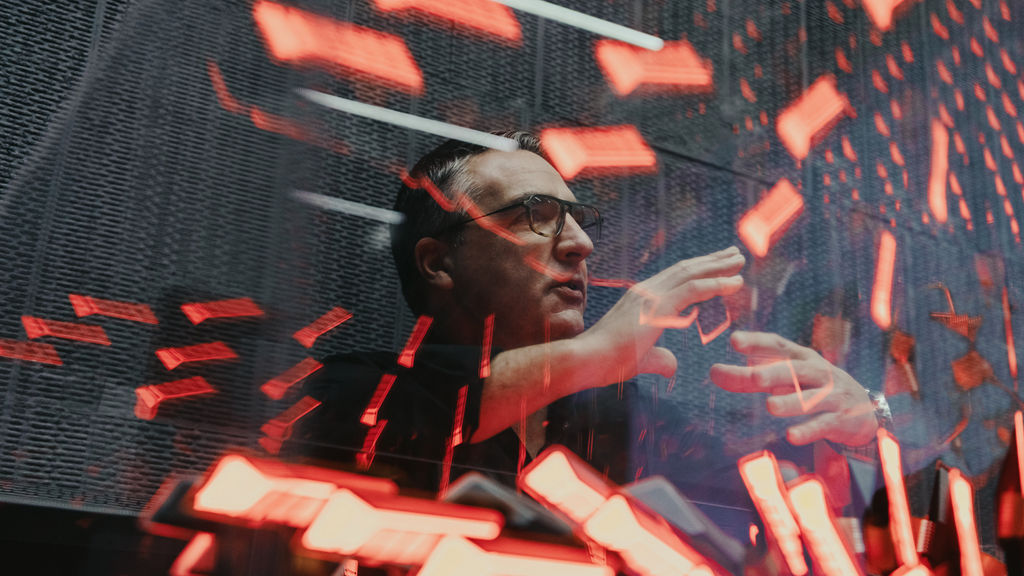 César Muntada, Head of Light Design at Audi, surrounded by headlights.