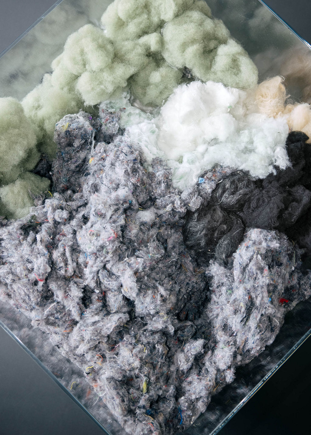 Samples of recycled fibers used in the interior initially in their original state.