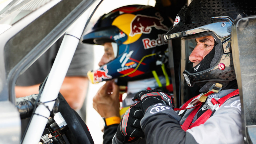 Carlos Sainz and Lucas Cruz in the cockpit of the Audi RS Q e-tron.