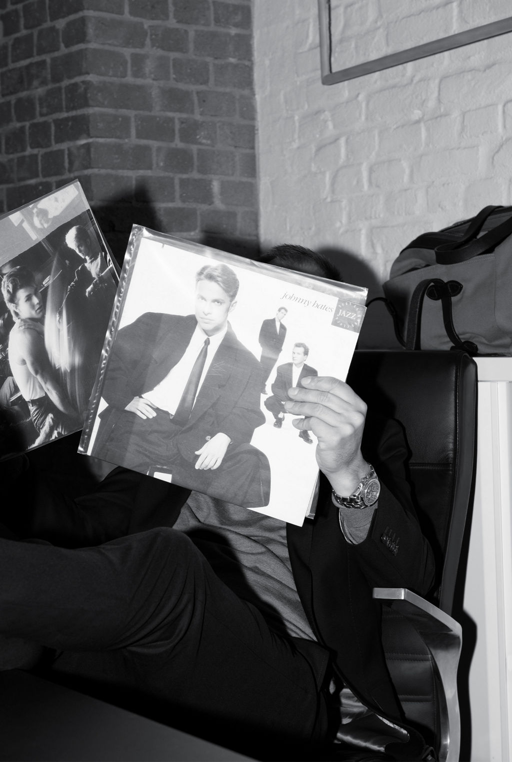 Marco Voigt holds up a few vinyl records for the camera.