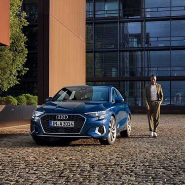 Audi A3 Sportback front view with model on the side
