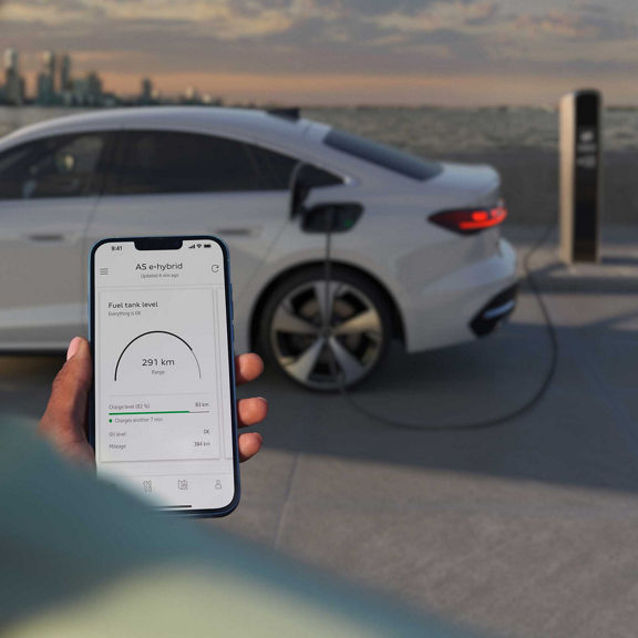 Audi A5 Sedan e-hybrid charging by the water