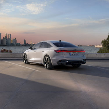Audi A5 Sedan e-hybrid In a parking lot outside the city