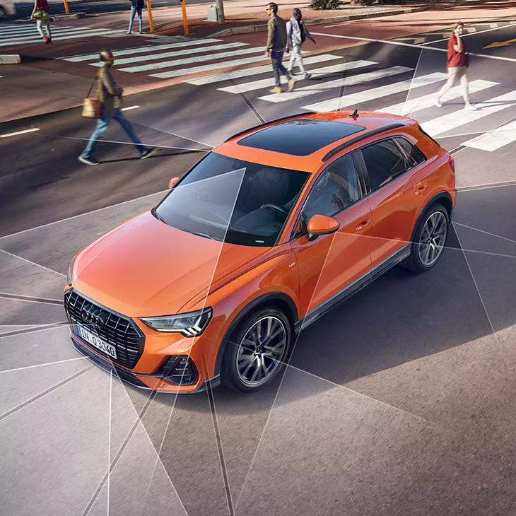 Audi Q3 drives in the city centre 