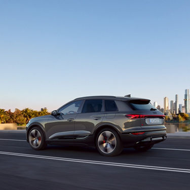 Dynamic side view Audi Q6 SUV e-tron