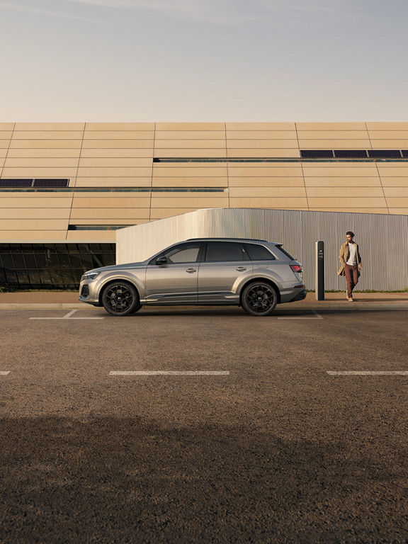 Audi Q7 SUV TFSI e side view during charging
