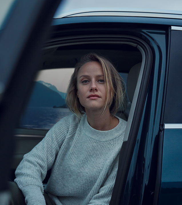 Woman sitting in Audi in cold weather