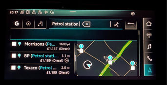 Audi electronic dashboard displaying information on fuel prices