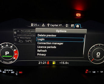 An Audi dashboard screen displaying options with 'Login' selected