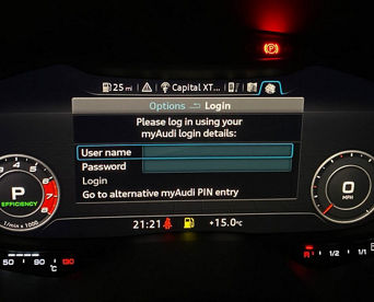 An Audi dashboard screen displaying a 'Login' screen with username and password fields visible