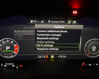 An Audi dashboard screen displaying options with 'Wi-Fi settings' selected