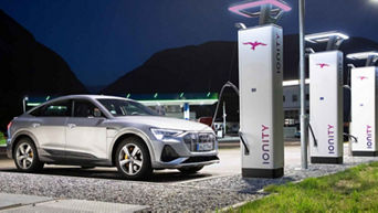 An Audi electric vehicle on charge beside an Ionity public charger