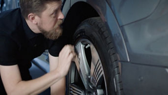 An Audi vehicle being inspected by an EV techinician