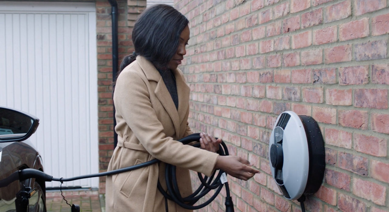   Video showing a woman charging her Audi electric vehicle at home