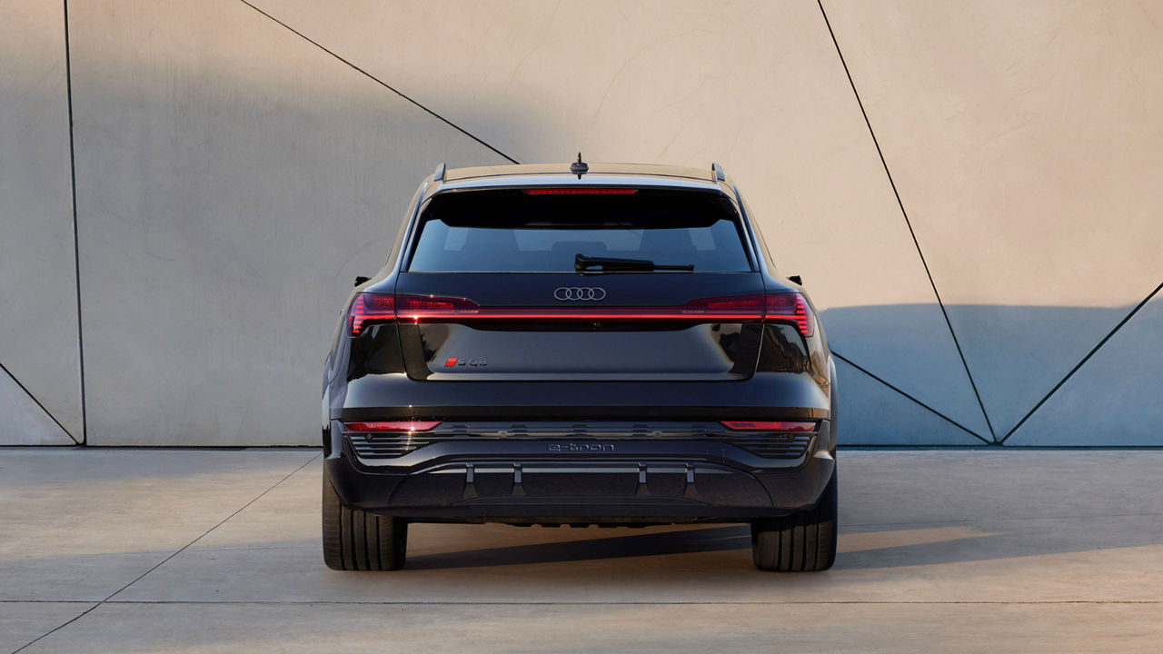 Rear view of a parked Audi electric vehicle in an urban setting