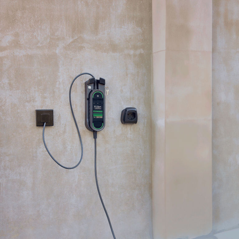 A charging station mounted to a wall