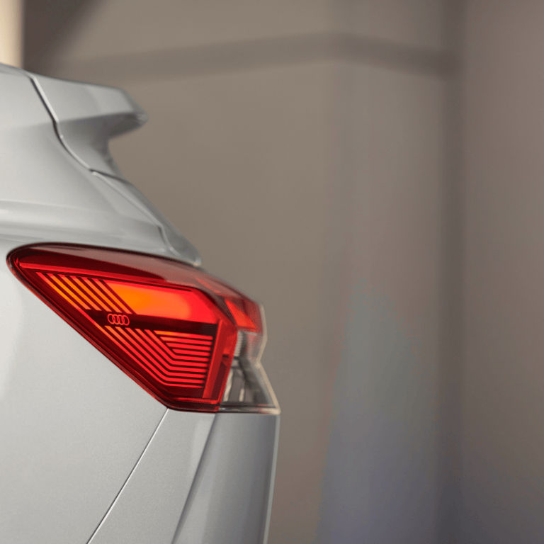 Rear of a silver Audi electric vehicle with the focus on the left rear light