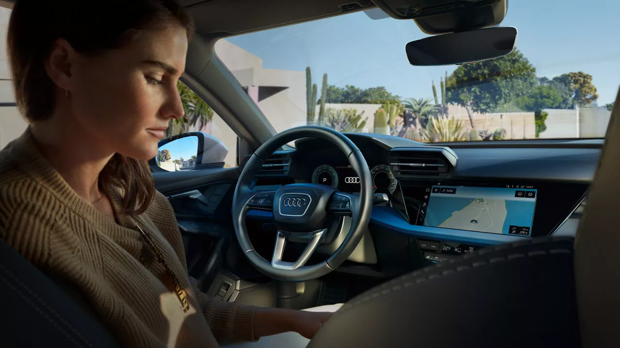 Interior view of an Audi vehicle with steering wheel and dashboard visible