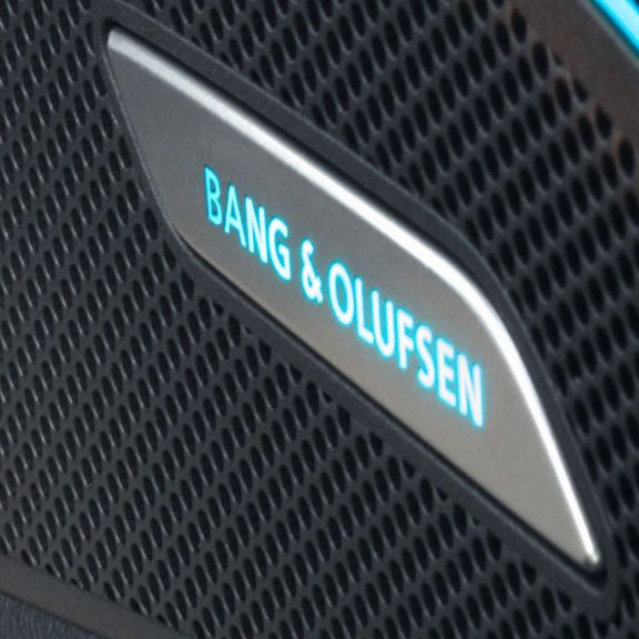 Close-up of a Bang & Olufsen speaker grille with logo.