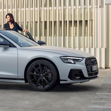 lady holding door open of Audi A8 S8