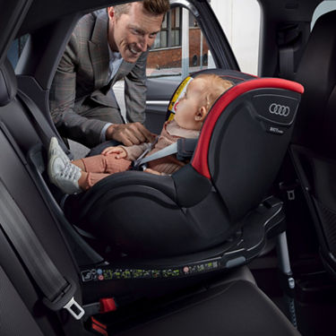 A baby in a car seat.