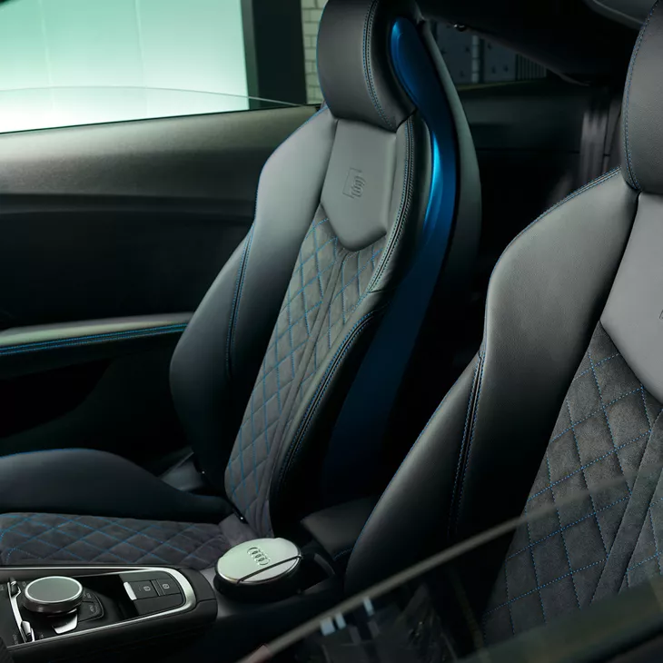 Interior front seats with blue trim.