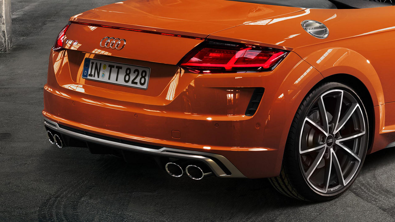  Rear view of back section of an orange Audi TT.