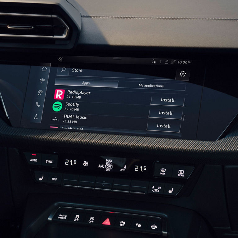 In-vehicle infotainment screen displaying app installation options, with climate controls below.