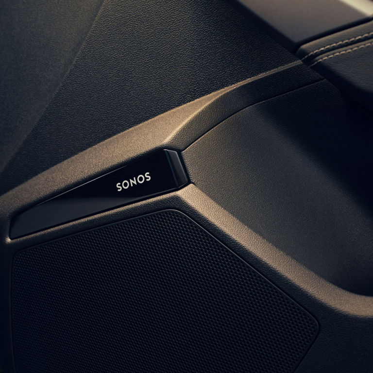 Close-up of a black Sonos speaker with logo, highlighting its textured design.