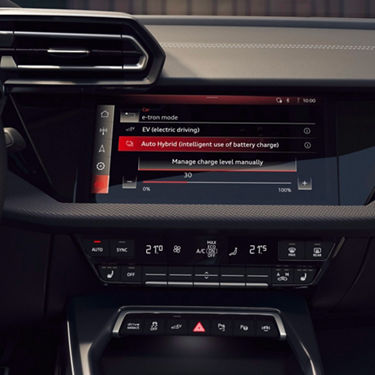 Interior view of a car's infotainment system displaying hybrid driving modes.
