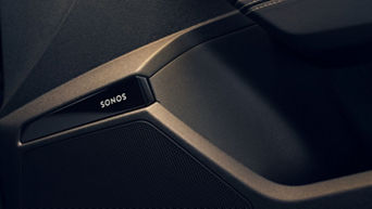 Close-up of a black Sonos speaker detail in a car door