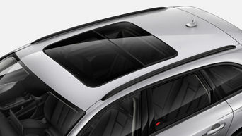 A modern silver car with a panoramic sunroof from an overhead angle.