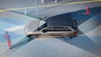 Illustration of a car's blind spot detection system with pedestrians and a cyclist nearby.