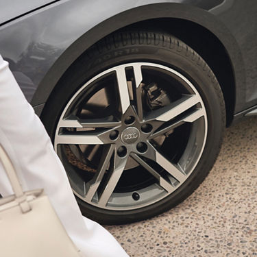 Close-up of an Audi car wheel with a five-spoke alloy rim.