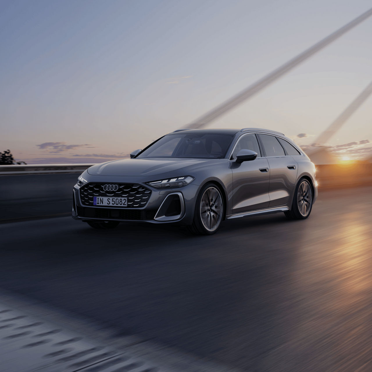 Audi car driving on highway at sunset, motion blur, clear sky.